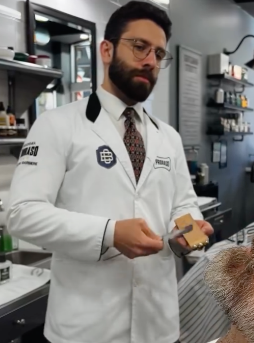 Proraso Master Barber Danilo sharpening his razor before a shave
