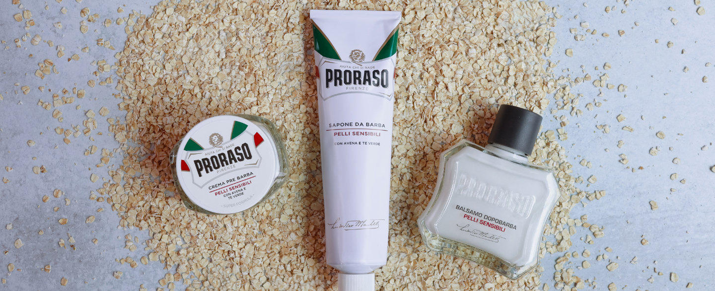 Sensitive Shave Line Pre-Shave, Shave Cream Tube + After Shave Balm laying on a bed of Oatmeal