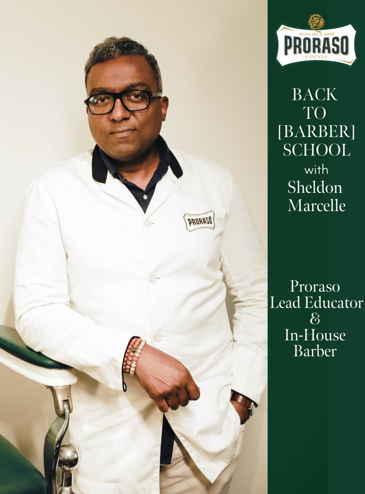 BACK TO [BARBER] SCHOOL: A FAMILY STORY SINCE 1908 shows Proraso Barber and Lead Educator Sheldon Marcelle posing in front of a vintage barber chair
