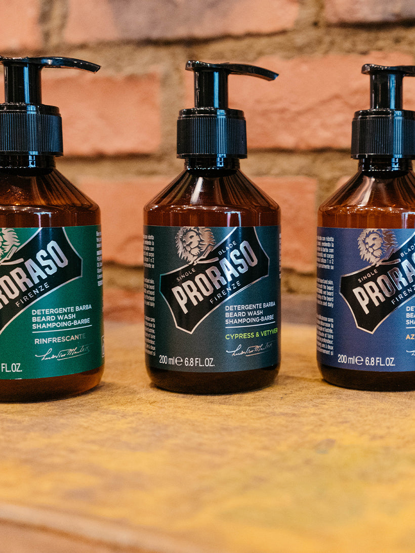 Refresh Beard Wash, Cypress & Vetyver Beard Wash, and Azur Lime Beard wash sitting on top of a shelf