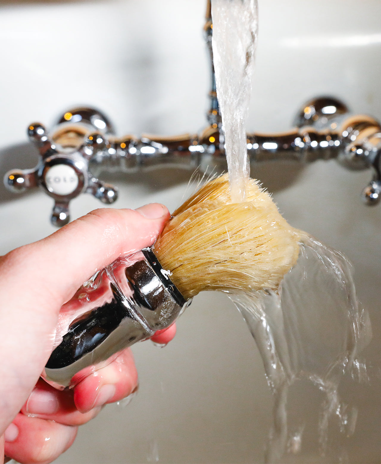 Professional Shave Brush being rinsed off in a vintage style sink