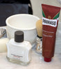 Products sitting on the bathroom counter Proraso Post-Shave Stone, Coarse Beard After Shave Balm, Professional Shaving Brush and Coarse Beard Shaving Cream Tube