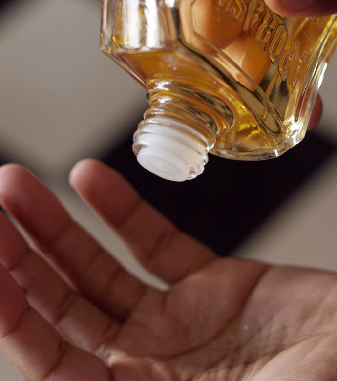 Coarse Beard After Shave Lotion being poured into a hand