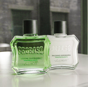 Refresh After Shave Lotion and After Shave Balm sitting next to each other on a white marble table in front of a window