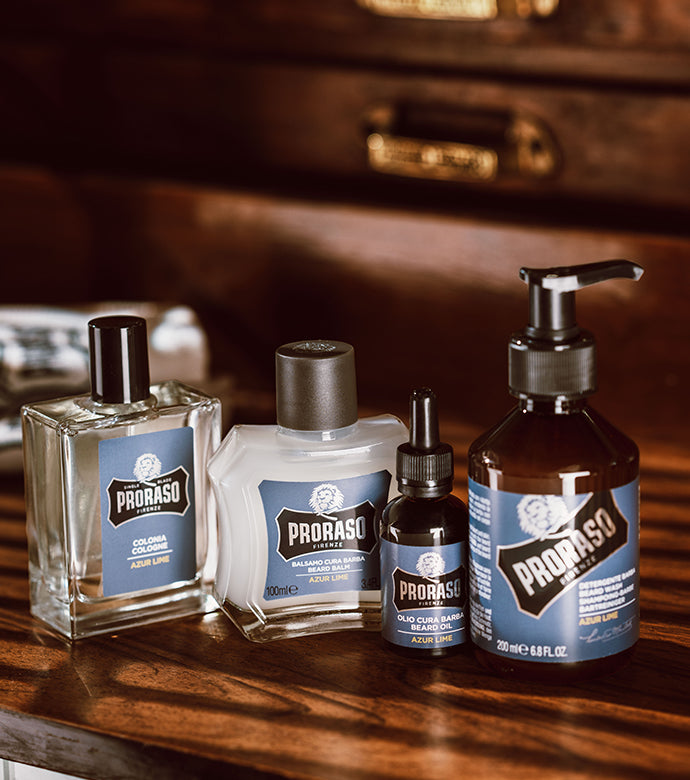 Azur Lime Beard full line up of Cologne, Beard Balm, Beard Oil, Beard Wash sitting on a wooden table