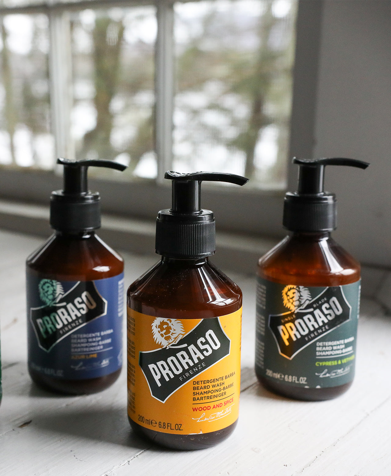 Beard Wash lineup on white wooden windowsill Azur Lime, Wood & Spice and Cypress & Vetvyer