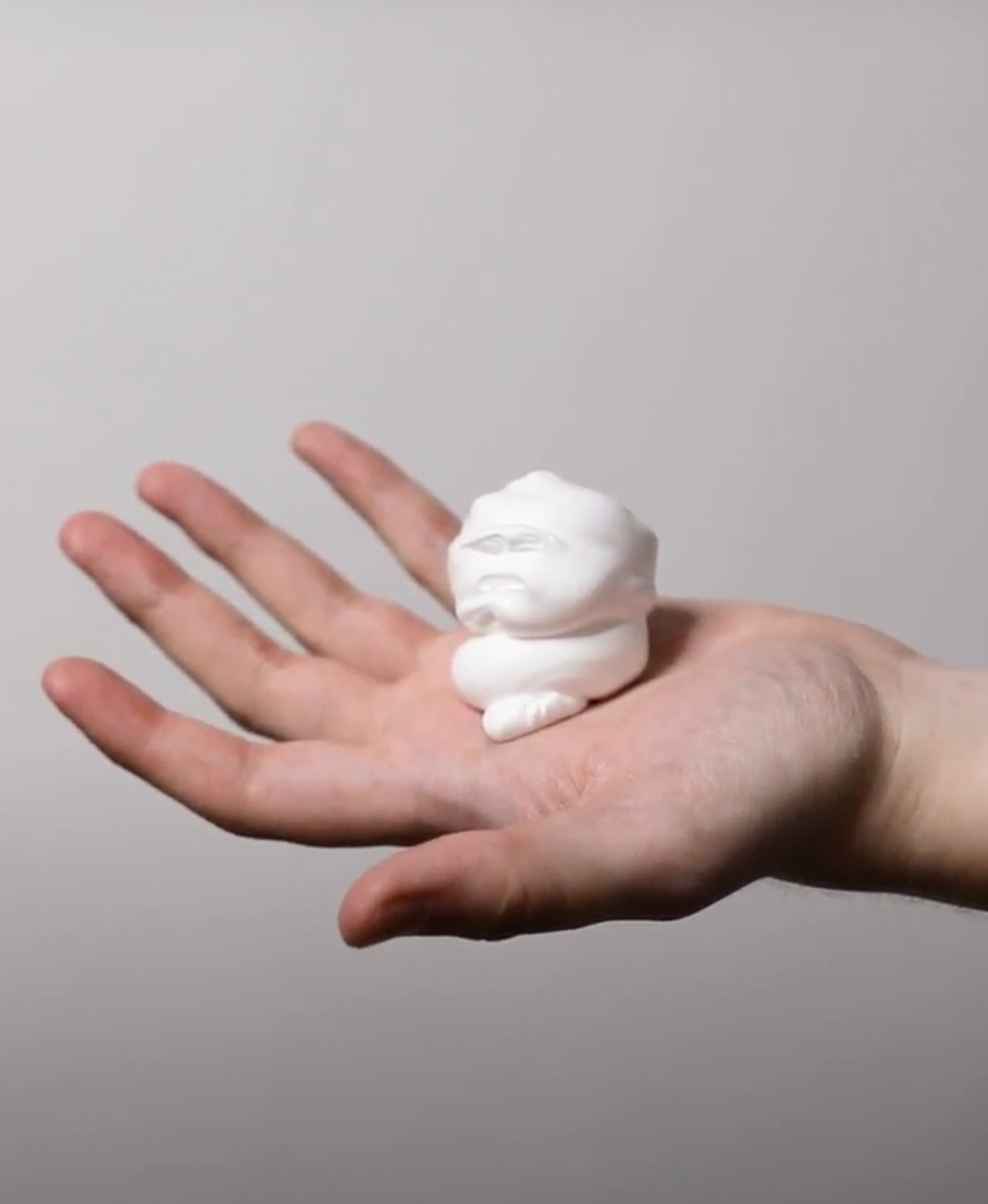 Large dollop of Coarse Beard Shave Foam on outstretched hand showing a thick lather