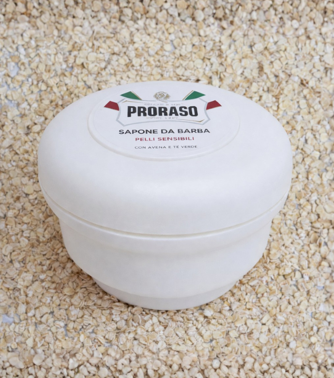 Sensitive Shave Soap in a Bowl sitting on key ingredient Oatmeal