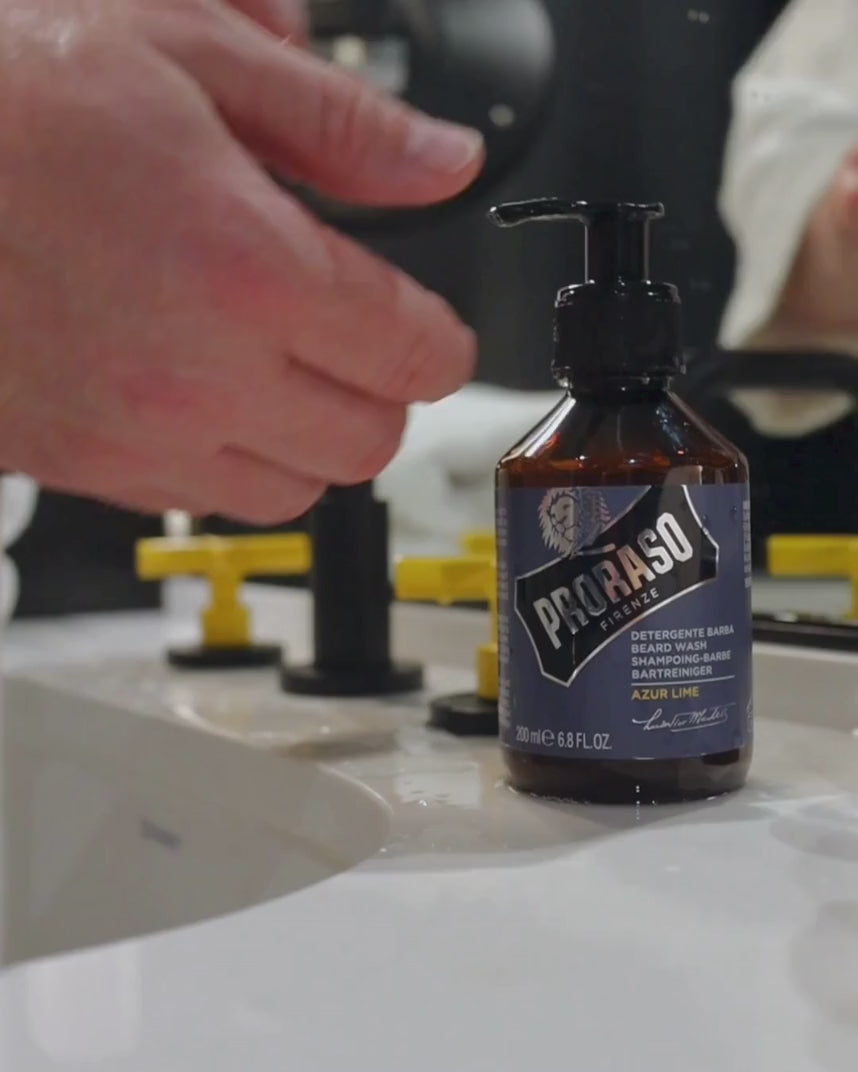 Man using Beard Wash in Azur Lime Fragrance to clean his full beard.