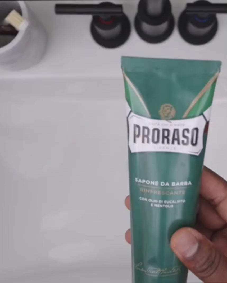 Man squeezing a dime-sized amount of Shave Cream into a bowl to create a thick lather 