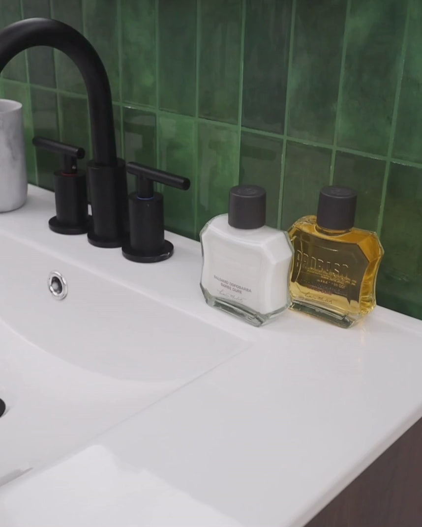 Man applying After Shave Balm for Coarse Beards in bathroom