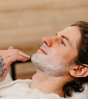 Proraso Refreshing Pre-Shave Cream being applied to face.