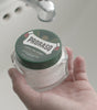 Proraso Refreshing Pre-Shave Cream jar held in hand.