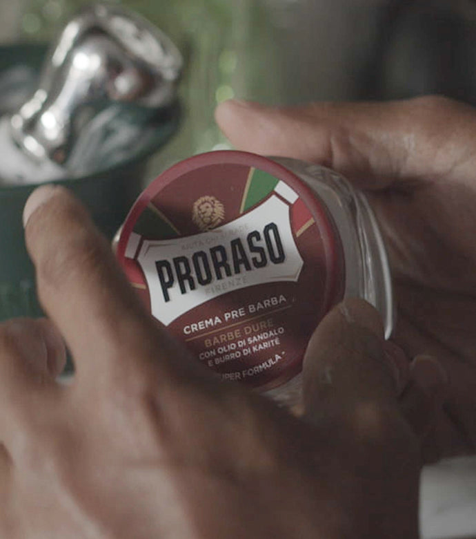 Proraso Nourishing for Coarse Beards Pre-Shave Cream jar being opened.