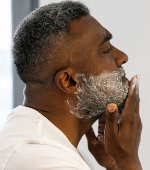 Proraso Protective Pre-Shave Cream being applied to the lower half of face before shave cream.