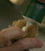 Proraso Refresh Shaving Cream being squeezed into bristles of Proraso Professional Shaving Brush.