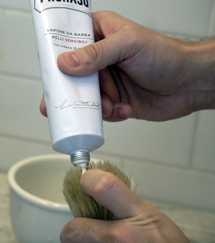 Just a dab will do! Proraso Sensitive Shave Cream Tube being squeezed into the Proraso Professional Shave Brush.