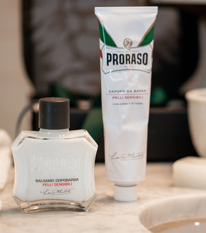 Proraso Sensitive Shave After Shave Balm with Proraso Sensitive Shave Cream Tube on bathroom counter.