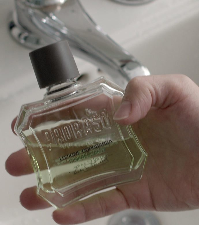 Proraso Refreshing After Shave Lotion in the palm of a hand before application.