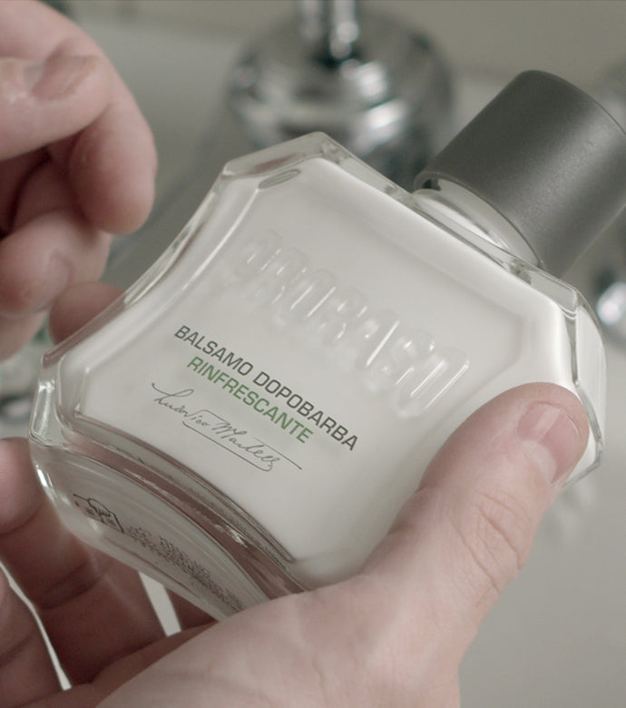 Proraso Refreshing After Shave Balm being held in hand, apply after shaving.
