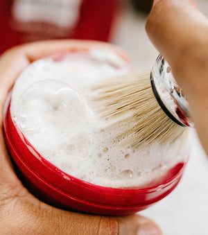 Proraso Nourishing for Coarse Beards Shaving Soap in a Bowl making a thick lather with a Proraso Professional Shave Brush.