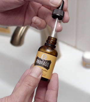 Proraso Wood & Spice Beard Oil dropper being pulled out of bottle.