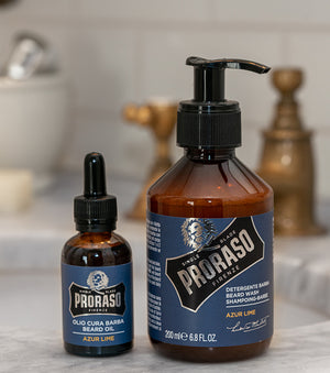 Proraso Azur Lime Beard Oil and Beard Wash on the bathroom counter next to sink.