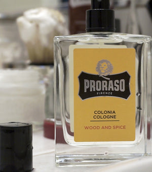Proraso Wood & Spice Cologne on bathroom sink.