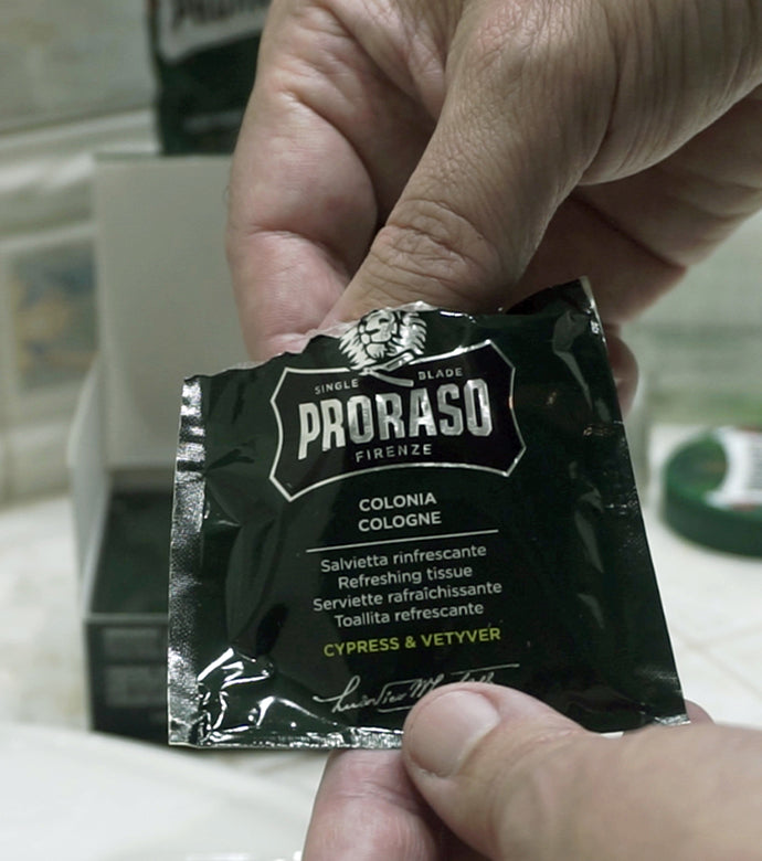 Proraso Cypress & Vetyver Refreshing Cologne Tissues being opened and removed from single packette.