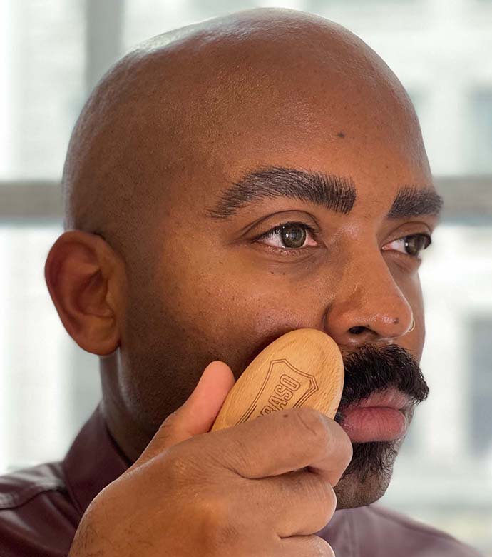 Proraso Moustache and Beard Brush being used to brush a short moustache. 